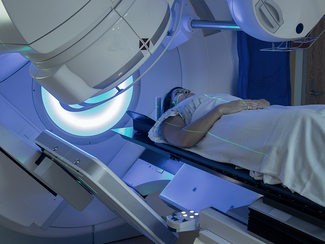 Woman getting radiotherapy against breast cancer