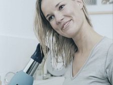 A woman drying her hair