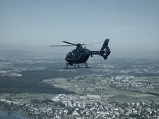 Helicopter of the federal police force flying over the area around Zurich